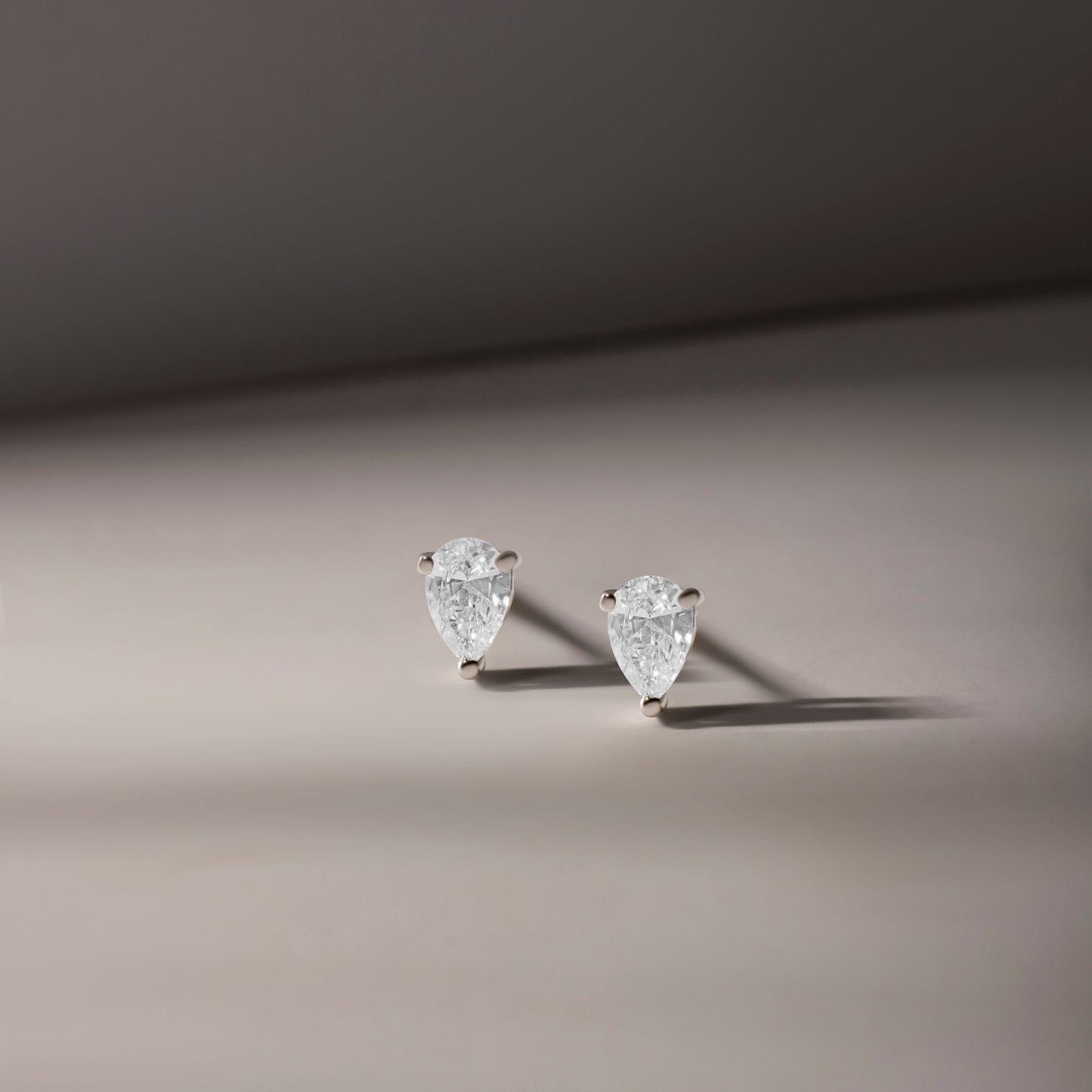 TWINKLING PEAR SHAPED DIAMOND EARRINGS